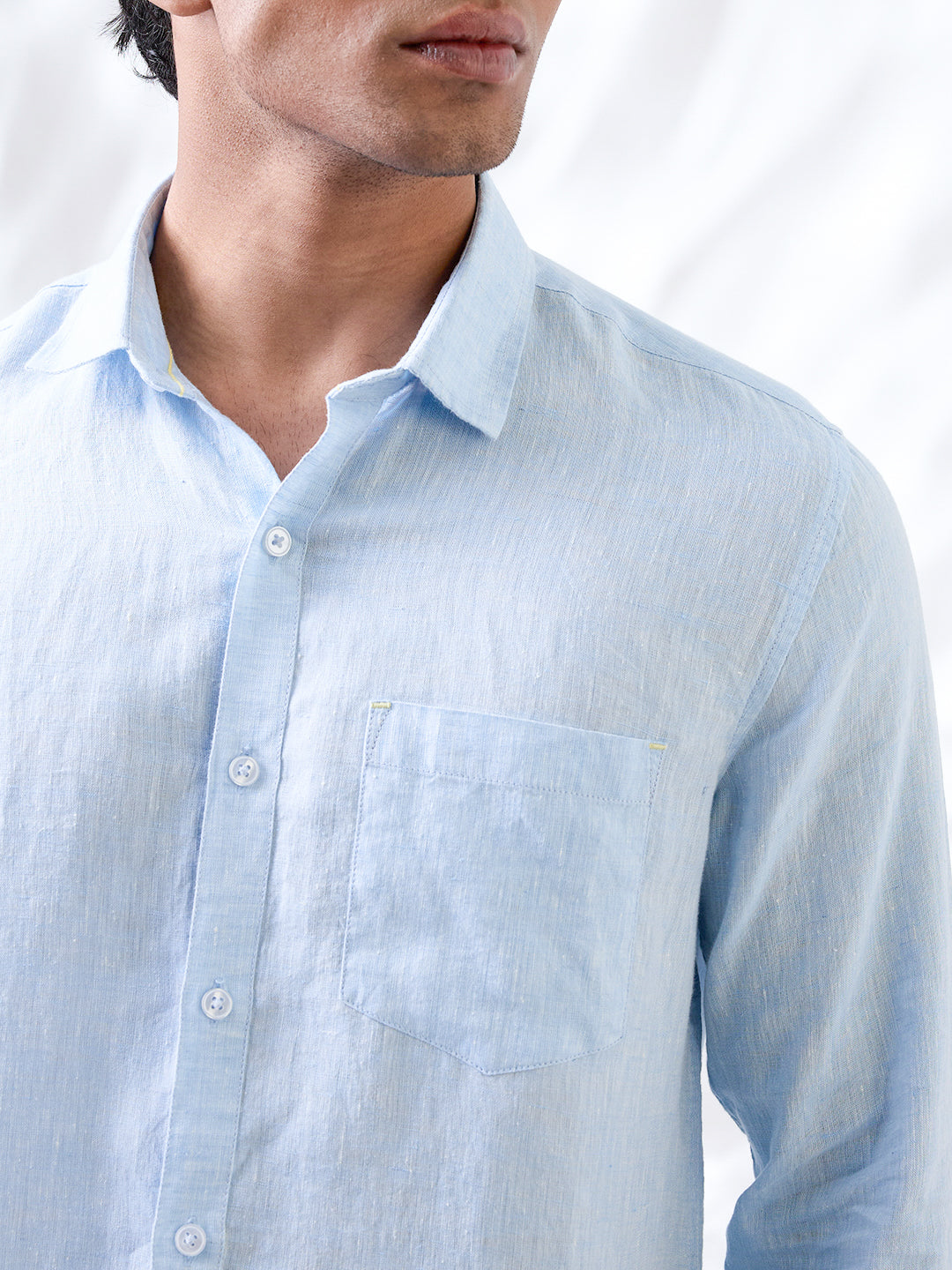 Solid blue shirt made from natural Indian linen, tailored in small batches